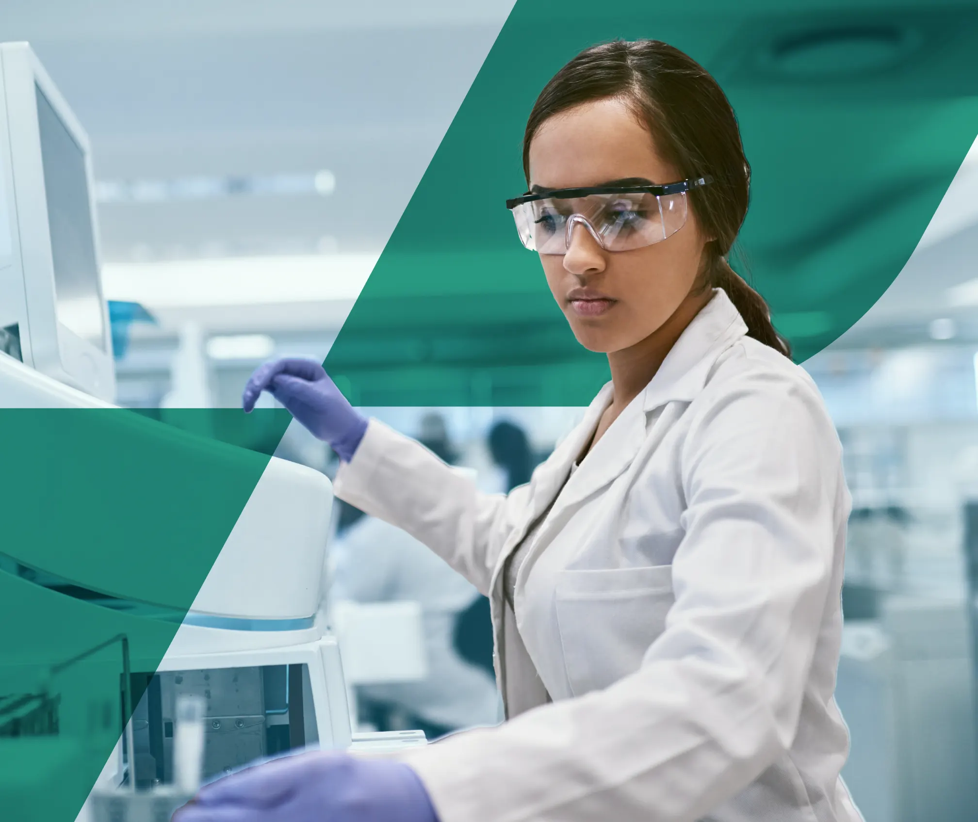 Young female scientist with personal protective equipment on working in a lab